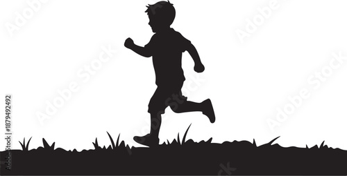 Silhouette of a boy running on grassy hill side