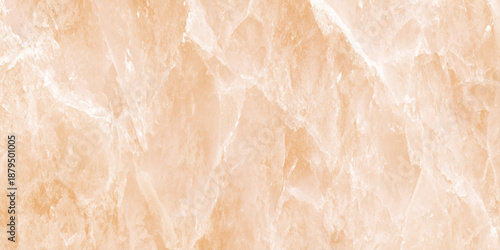 A close up view of a beautiful orange onyx marble surface with natural veining and a polished texture is visible