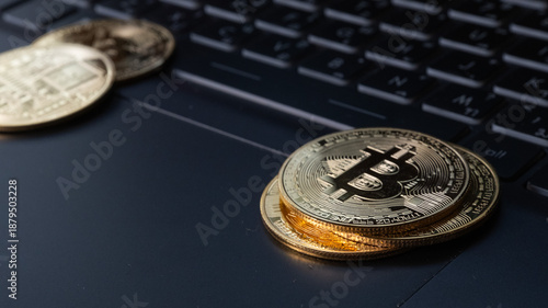 Closeup on Bitcoins Crypto currency on notebook 