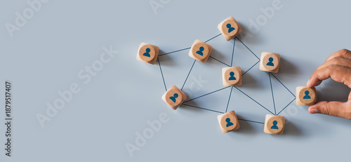 Organizational network structure with connected people icons on wooden blocks, showing team collaboration, stakeholder mapping, social graph, and business communication on a light background