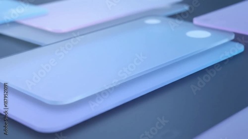 Close-up of stacked translucent smartphone mockups with rounded corners and dual camera lenses in a soft blue and purple hue against a dark background.