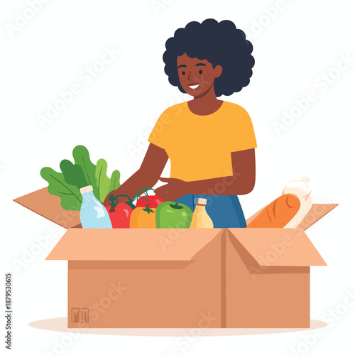 A smiling woman unpacking groceries from a cardboard box filled with fresh produce and household essentials