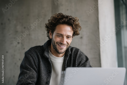 Happy Man Using Laptop