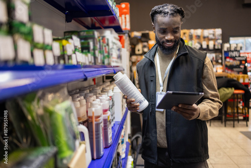 Εκτύπωση καμβά Motorcycle equipment salesman holding a tablet