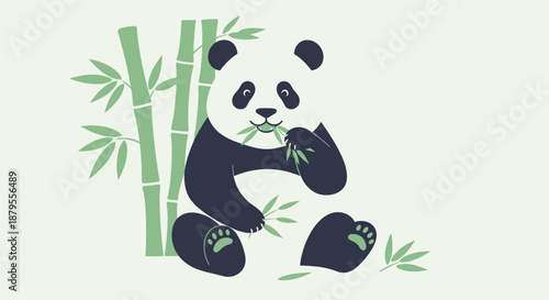 A cute panda bear sits and eats bamboo leaves