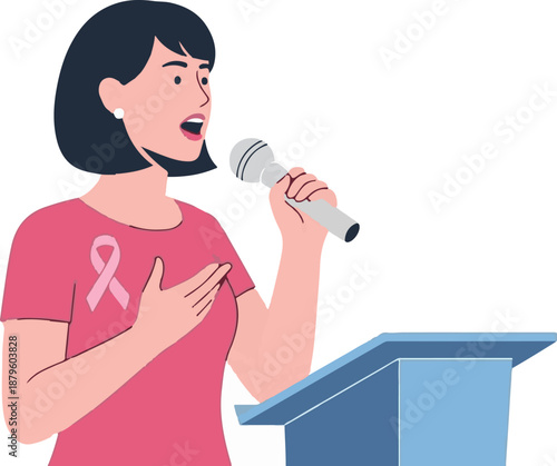 Woman speaking into microphone at podium, wearing pink shirt with breast cancer ribbon