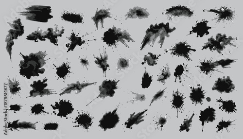 Collection of ink blots and splatters in various shapes and sizes, ranging from small dots to large splashes