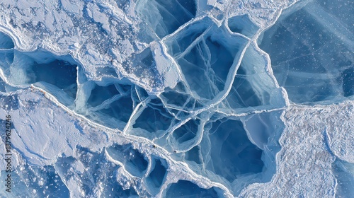 Aerial View of Cracked Blue Ice Surface with White Frost Patterns in Winter Season Texture Background at Lake Baikal Russia High Angle