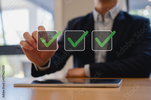 Businessman using pen tick check mark, digital documents and files hologram. Copy space, business process approval documents, quality, confirmation, check, validation, approval, checkbox