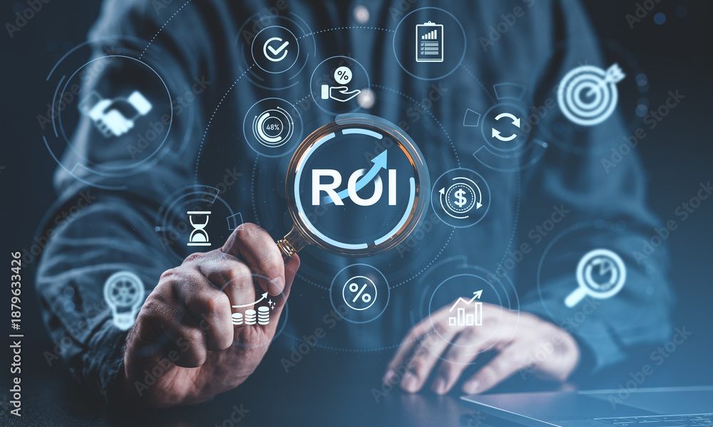 Fototapeta premium Business ROI analysis concept with businessman using magnifying glass to examine return on investment symbol on digital interface background.