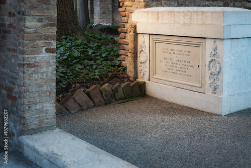 Detail of an ancient marble commemorative monument with Italian inscriptions located in a quiet historic garden in Ravenna