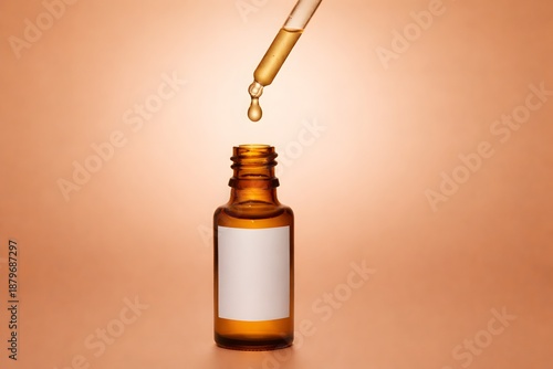 Skincare essential oil dripping from pipette into amber bottle mockup