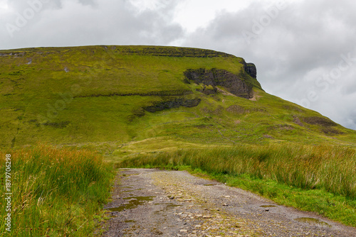 a view from the valley up to the peak of the famous ben bulben mountain in sligo at a cloudy summer day, ireland