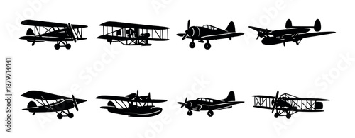 Silhouettes of vintage airplanes: biplanes and propeller aircraft in low light