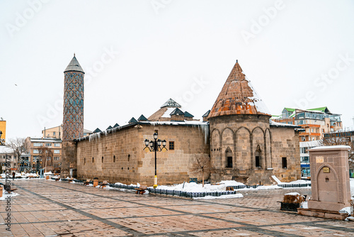 Yakutiye Medrese appears covered in snow as clear stone textures emerge in the winter light.Erzurum,Turkiye.