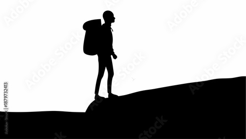 Hiker standing on mountain peak with backpack looking adventurous