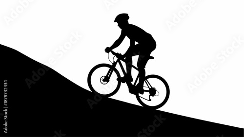 Cyclist riding bike uphill with determination and strength