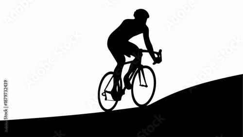 Cyclist riding uphill with determination and strength