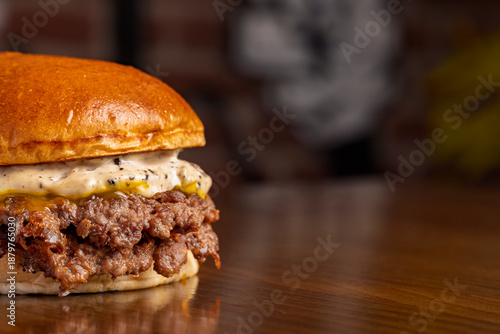 A smash burger with sauce