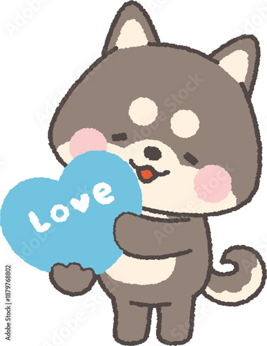 「love」と書かれたハートを持つ黒い柴犬