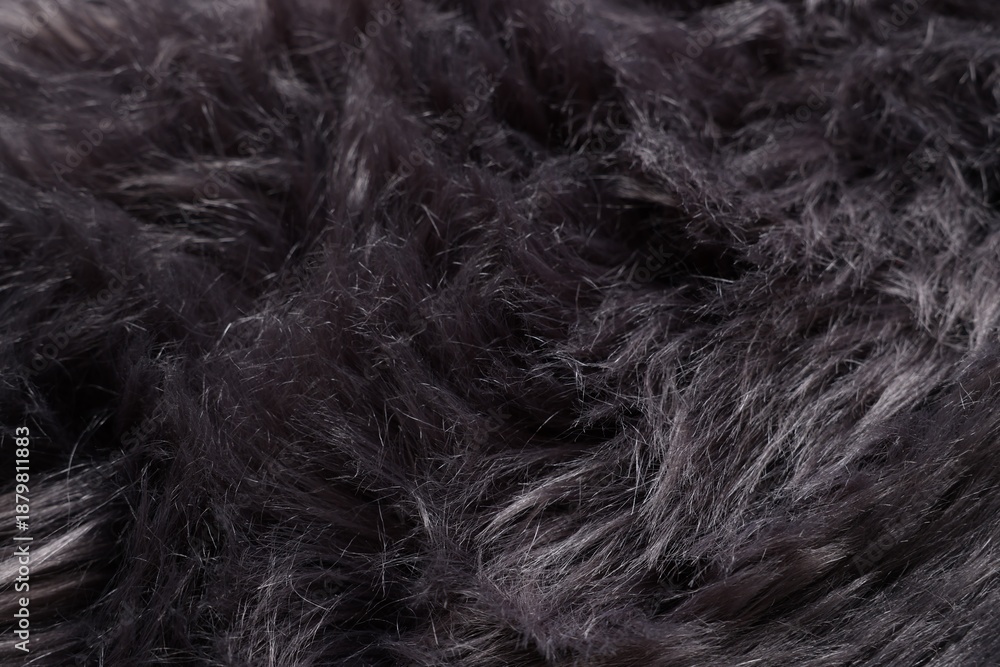 Obraz premium Texture of black fluffy fabric as background, closeup