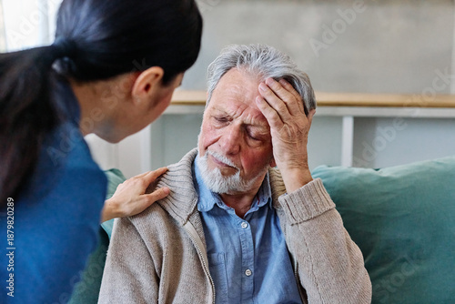 Wallpaper Mural Doctor or nurse caregiver's hand giving support to sad lonely senior man at home or nursing home Torontodigital.ca