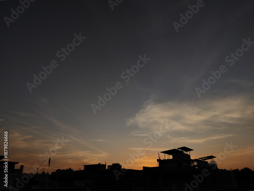 Jaipur, India 17 January 2026: Picture of urban sunset silhouette with golden hour sky
