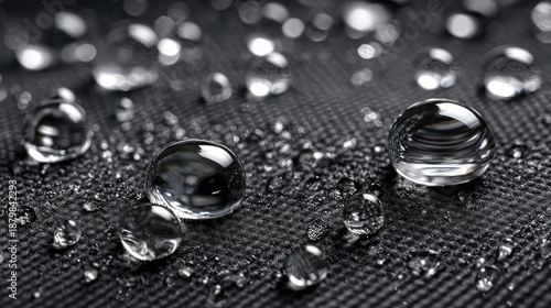 Black nylon fabric texture, waterproof material, backpack surface, synthetic textile background, durable 