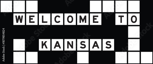 Alphabet letter in word welcome to kansas on crossword puzzle background
