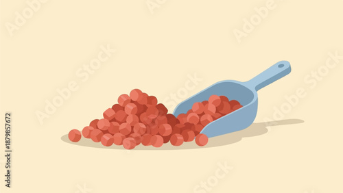 A blue scoop rests partially in a pile of small, red, spherical objects