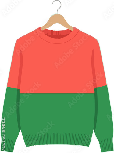A coral and green two-tone long-sleeved sweater on a wooden hanger