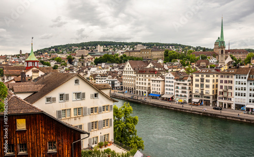 Zurich along the Limmat River from Lindenhof Hill. University and hill in background. Switzerland