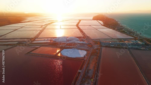 Aerial view of the Margherita di Savoia salt mines at sunset in Puglia, Italy