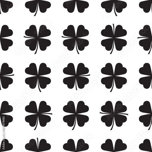 Seamless pattern of black four leaf clovers on white background