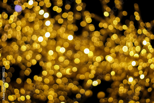 shiny golden circle bokeh on black for background.