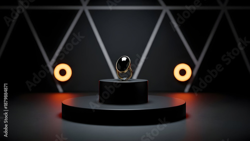 Oscar statuette on a pedestal with spotlights