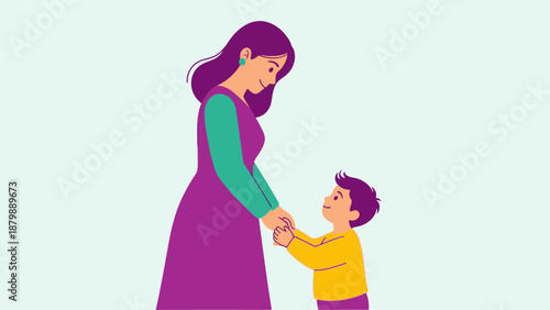 A loving mother holds her young son's hands tenderly, creating a heartwarming moment of connection and familial bond