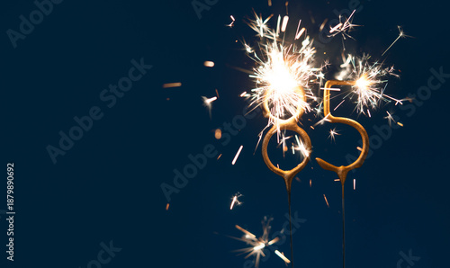 Valokuva 85 years anniversary celebration festive background made with Bengal fires in the form of number Eighty five