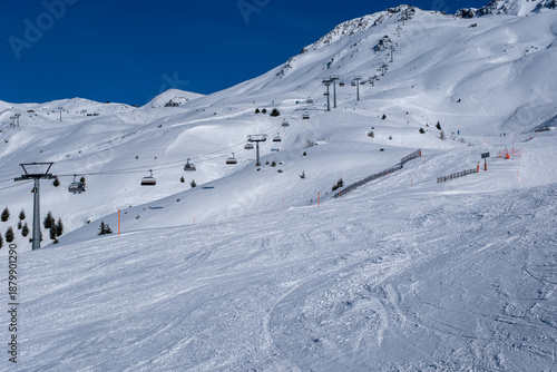 Ski slopes, skiers and beautiful winter landscape in Swiss Alps, Ski region Arosa-Lenzerheide