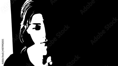 High contrast monochrome portrait of a person with shadowed half face.