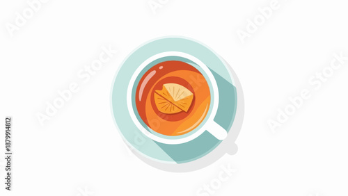 A top view of a white teacup filled with orange liquid, garnished with a slice of fruit