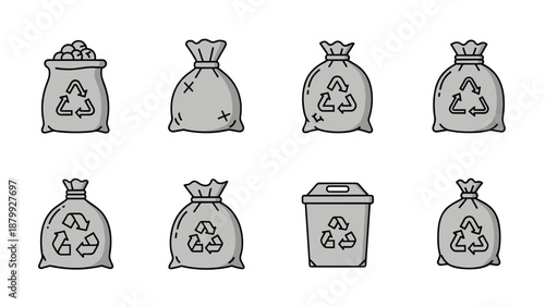 Collection of recycling and trash bags with recycling symbols and a bin
