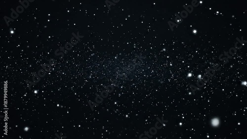 Light particles drifting gently in dark space background