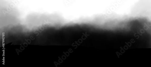 Thick, dark smoke billows across the image, overshadowing the lower portion. The smoke transitions