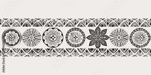 Intricate black and white floral and geometric pattern repeating as a decorative border