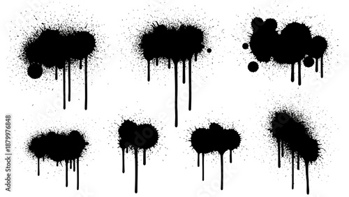 Set of black ink splashes and blots forming tree and plant silhouettes in a grunge vector illustration style