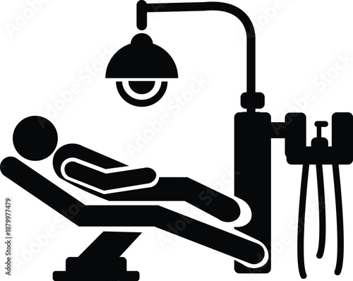 Patient receiving professional dental care and examination under an overhead light