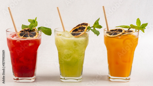 Drink for hot summer days. Fresh lime and lemon lemonade, dark green with bokeh background
