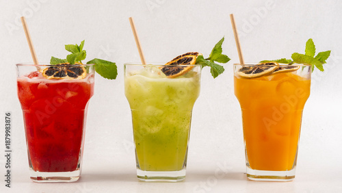 Drink for hot summer days. Fresh lime and lemon lemonade, dark green with bokeh background
