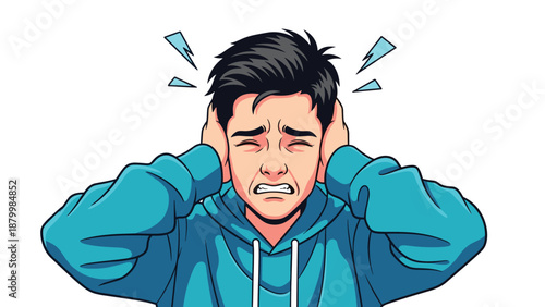 Young man in a blue hoodie covers his ears in distress from a loud noise, his face scrunched up in pain and annoyance.